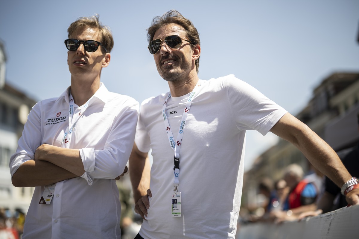 Raphael Meyer, CEO, and Fabian Cancellara, owner of Tudor Pro Cycling Team, look on prior the second stage, a 173.7 km race from Beromuenster to Nottwil, at the 86th Tour de Suisse UCI World Tour cycl ...