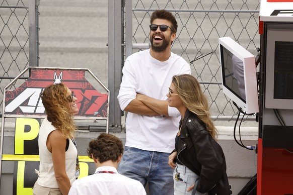 Former Barcelona football star Gerard Pique and his girlfriend Clara Chia Marti stand at pit prior to the start of the MotoGP race of the Catalunya Motorcycle Grand Prix at the Catalunya racetrack in  ...