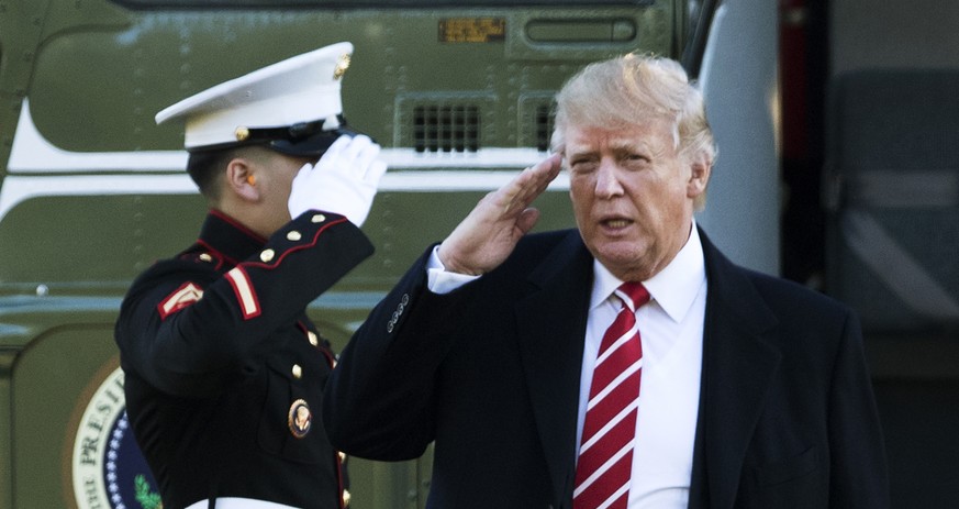 FILE - In this Monday, Feb. 6, 2017, file photo, U.S. President Donald Trump salutes a Marines honor guard as he disembarks from Marine One upon arrival at the White House in Washington. A top Chinese ...