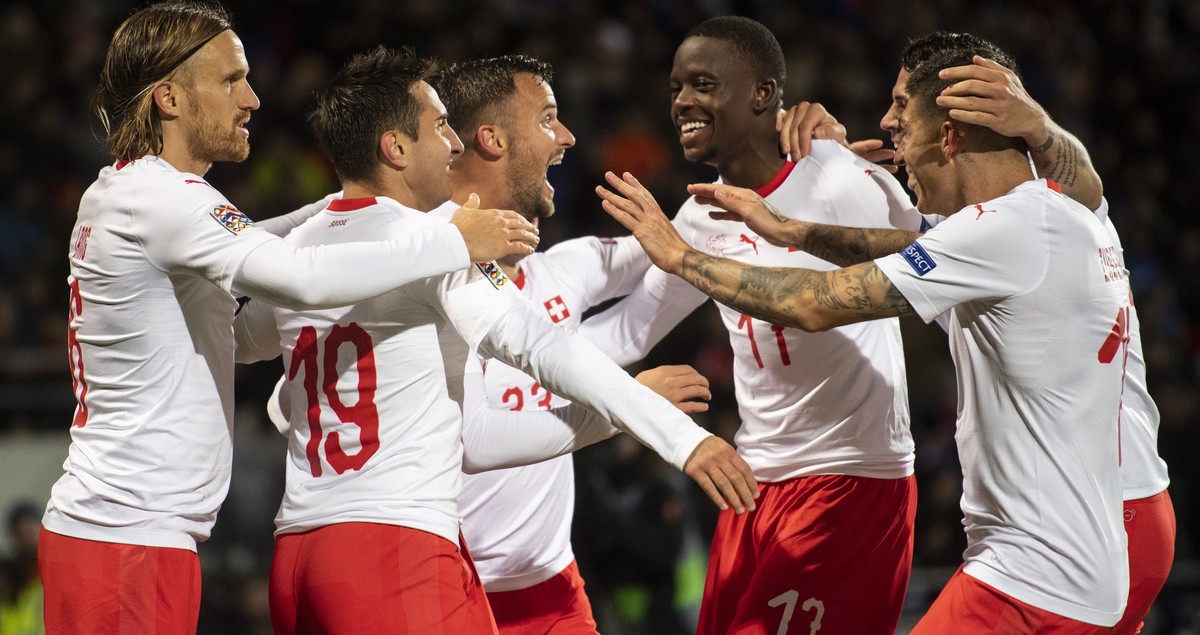 Switzerland's Haris Seferovic, center, celebrate his 1:0 goal during the UEFA Nations League soccer match between Iceland and Switzerland at the Laugardalsvoellur stadium in Reykjavik, Iceland, o ...