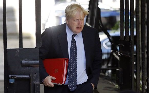 Secretary of State for Foreign and Commonwealth Affairs Boris Johnson arrives for a cabinet meeting at 10 Downing Street after the general election in London, Tuesday, June 13, 2017.(AP Photo/Frank Au ...