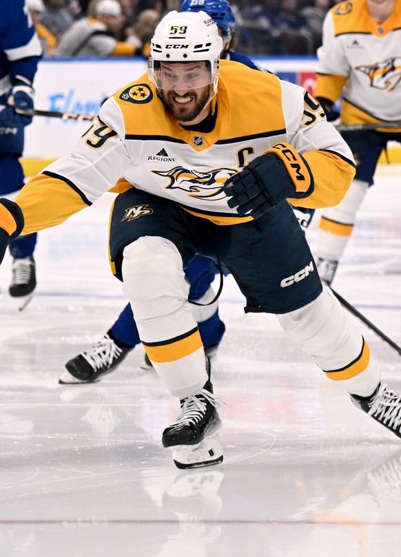 Nashville Predators defenseman Roman Josi (59) reaches for the puck during the third period of an NHL hockey game against the Tampa Bay Lightning, Sunday, March 29, 2026, in Tampa, Fla. (AP Photo/Jaso ...