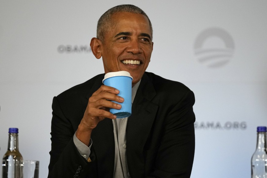 Former U.S. President Barack Obama smiles as he attends a roundtable meeting at the COP26 U.N. Climate Summit in Glasgow, Scotland, Monday, Nov. 8, 2021. The U.N. climate summit in Glasgow gathers lea ...