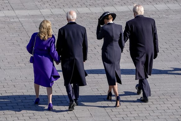President Donald Trump, from right, and first lady Melania Trump walk with former President Joe Biden and Jill Biden to board a Marine helicopter as the Bidens depart to Joint Base Andrews after the 6 ...