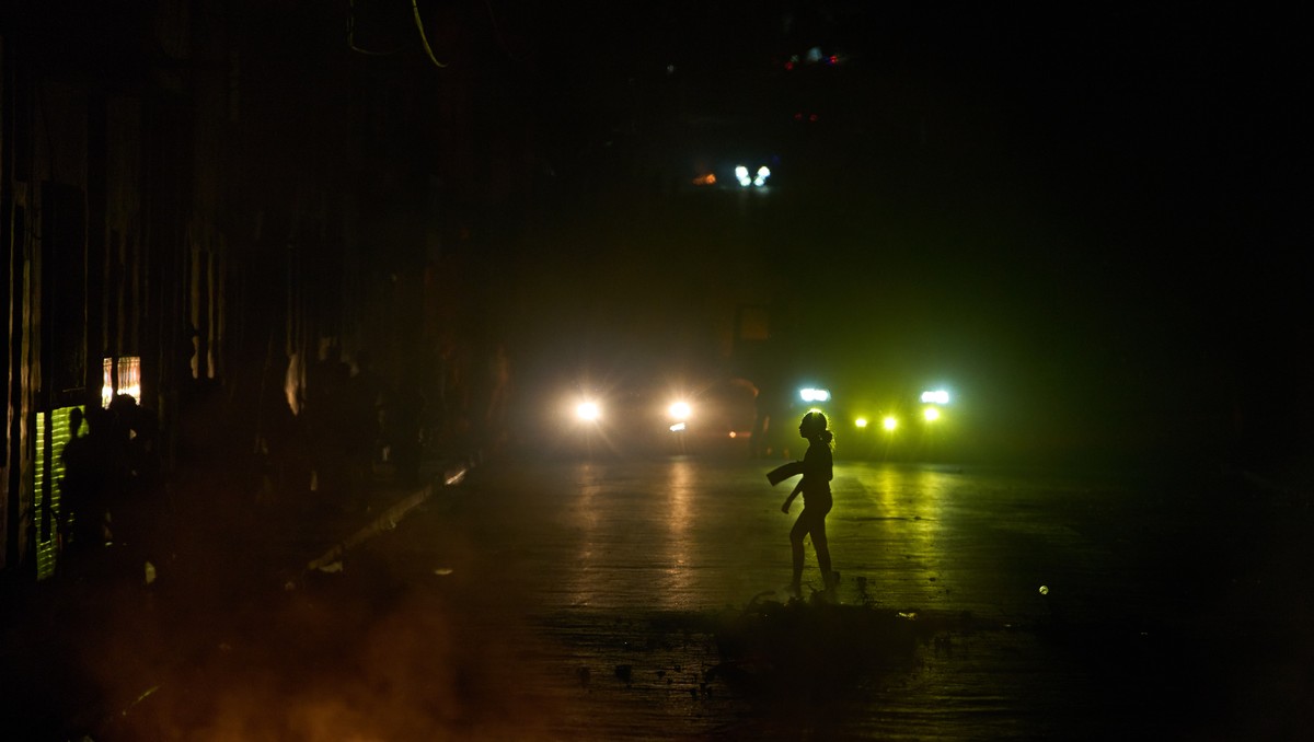 A woman walks in front of a barricade set up by residents protesting against prolonged power outages in Havana, Cuba, Wednesday, May 13, 2026. (AP Photo/Ramon Espinosa)
Cuba Energy Crisis