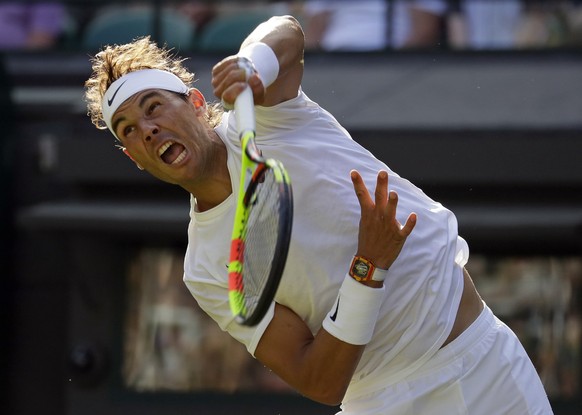 Spain&#039;s Rafael Nadal serves to Japan&#039;s Sugita Yuichi in a singles match during day two of the Wimbledon Tennis Championships in London, Tuesday, July 2, 2019. (AP Photo/Kirsty Wigglesworth)