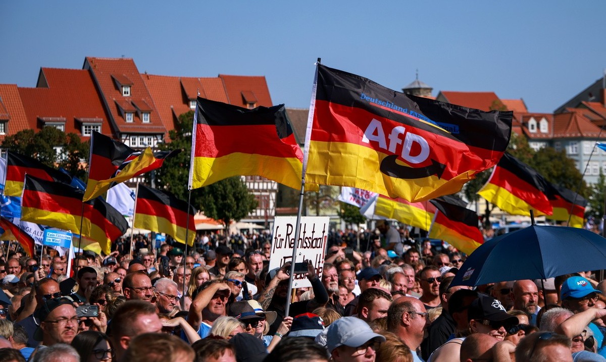 epa11575677 Supporters of far-right Alternative for Germany (AfD) party await the speech of faction chairman in the regional parliament of Thuringia Bjoern Hoecke, top candidate for the upcoming 2024  ...
