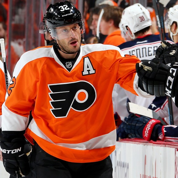 PHILADELPHIA, PA - NOVEMBER 22: Mark Streit #32 of the Philadelphia Flyers celebrates his goal with teammates on the bench after he scored in the first period against the Columbus Blue Jackets on Nove ...