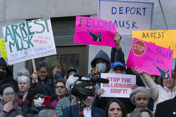 FILE - People protest during a rally against Elon Musk outside the Treasury Department in Washington, Tuesday, Feb. 4, 2025. (AP Photo/Jose Luis Magana, File)
Protest