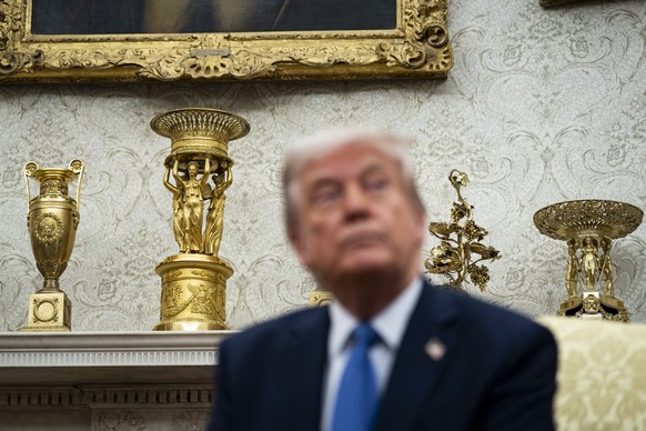 epa12052661 Gold decor on the mantle behind US President Donald Trump during a meeting with Norway&#039;s prime minister Jonas Gahr Store, not pictured, in the Oval Office of the White House in Washin ...