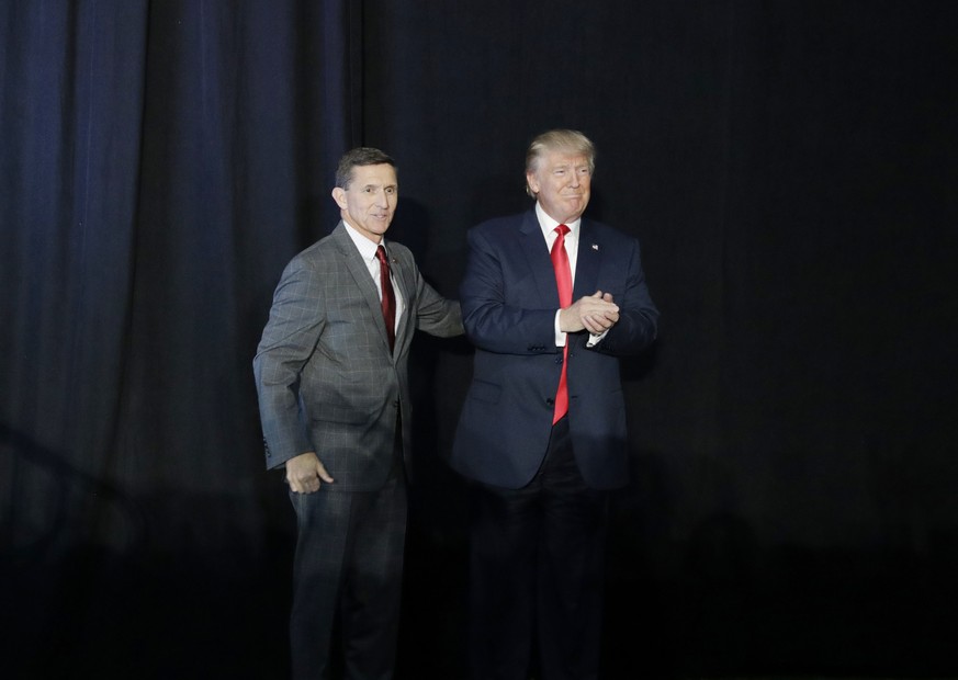 FILE - In this Sept. 29, 2016, file photo, retired Gen. Michael Flynn, left, introduces then-Republican presidential candidate Donald Trump at a campaign rally, in Bedford, N.H. Flynn, the former Nati ...