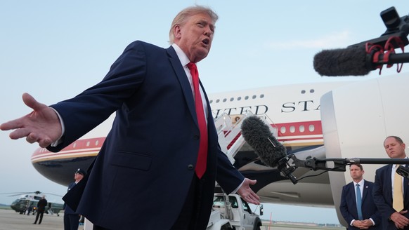President Donald Trump speaks to reporters as he exits Air Force One at Joint Base Andrews, Md., after attending the World Cup final soccer match, Sunday, July 19, 2026. (AP Photo/Jacquelyn Martin)
Do ...