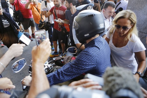 Outgoing Greek Finance Minister Yanis Varoufakis, left, and his wife Danae Stratou leave on a motorcycle after his resignation in Athens, Monday, July 6, 2015. Greece and its membership in Europe&#039 ...