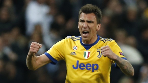 Juventus&#039; Mario Mandzukic celebrates scoring his side&#039;s 2nd goal during a Champions League quarter final second leg soccer match between Real Madrid and Juventus at the Santiago Bernabeu sta ...