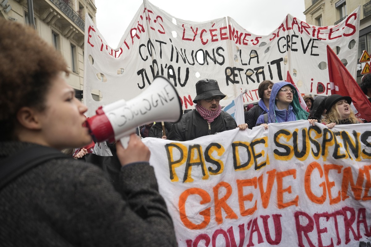 Students demonstrate Friday, April 14, 2023 in Paris. France's top constitutional body was expected to rule Friday on whether President Emmanuel Macron's contested plan to raise the retireme ...