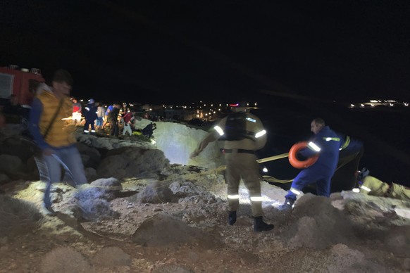 Authorities and local residents take part in a large-scale rescue operation on the island of Kythira, some 225 kilometers (140 miles) south of Athens, early Thursday, Oct. 6, 2022. The operation is un ...