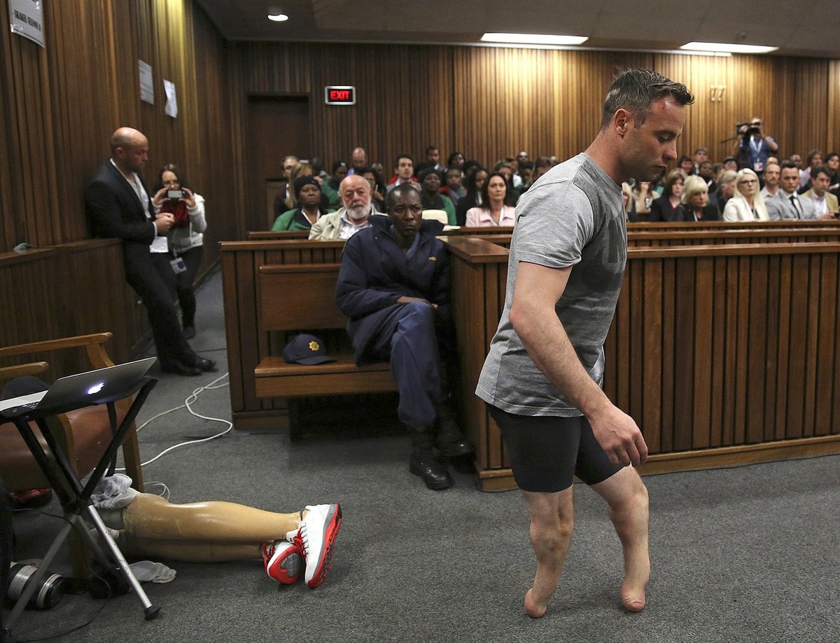 2016 AP YEAR END PHOTOS - Oscar Pistorius' prosthetics lie on the floor as he walks on his amputated legs during argument in mitigation of sentence by his defense attorney Barry Roux in the High  ...