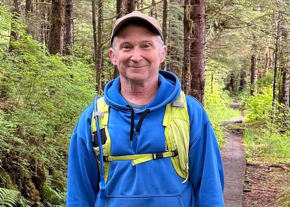 In this image provided by Karen Dillman, Alaska Senate candidate Dan Sullivan, one of the challengers to the incumbent senator, also named Dan Sullivan, poses for a photo on a hike, Sunday, June 7, 20 ...