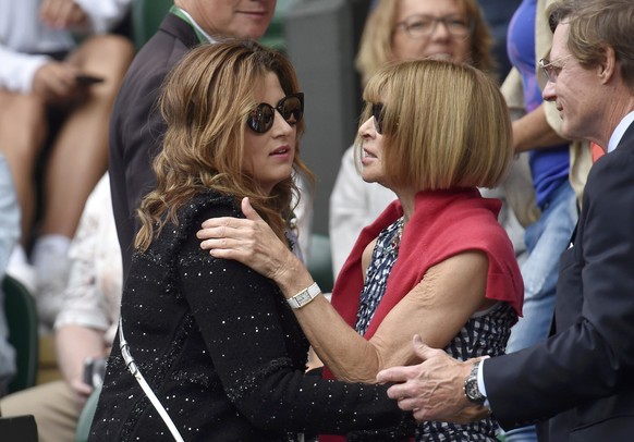 Editor of American Vogue Anna Wintour greets Mirka Federer, wife of Roger Federer of Switzerland before his Men&#039;s Singles Final match against Novak Djokovic of Serbia at the Wimbledon Tennis Cham ...