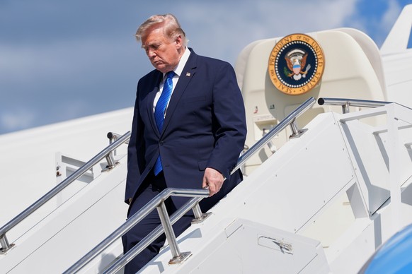President Donald Trump exits Air Force One at Morristown Municipal Airport in Morristown, N.J., Friday, July 31, 2026, after a trip to Camp David, the presidential retreat. (AP Photo/Jacquelyn Martin) ...