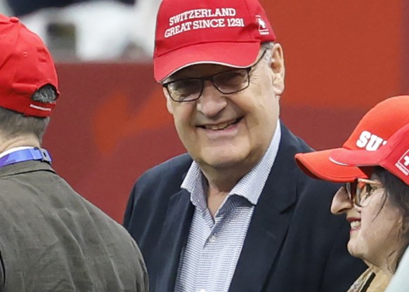 Swiss Federal President Guy Parmelin wears a hat with the writing "Switzerland Great since 1291" prior to the World Cup round of 32 soccer match between Switzerland and Algeria at the BC Pla ...