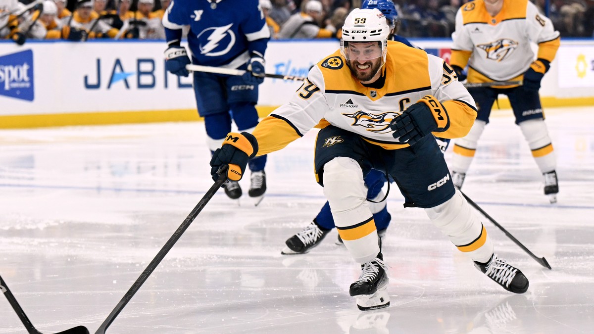 Nashville Predators defenseman Roman Josi (59) reaches for the puck during the third period of an NHL hockey game against the Tampa Bay Lightning, Sunday, March 29, 2026, in Tampa, Fla. (AP Photo/Jaso ...