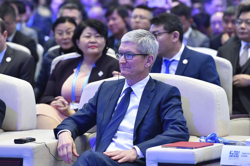 Apple's CEO Tim Cook attends the opening ceremony of the Fourth World Internet Conference in Wuzhen town in Tongxiang, East China's Zhejiang province, Sunday Dec. 03, 2017. (Chinatopix Via AP)