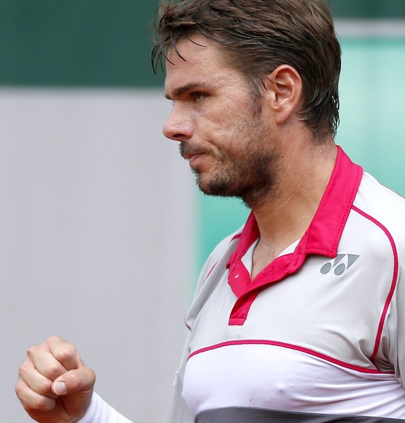 epa04770025 Stan Wawrinka of Switzerland in action against Dusan Lajovic of Serbia during their second round match for the French Open tennis tournament at Roland Garros in Paris, France, 27 May 2015. ...