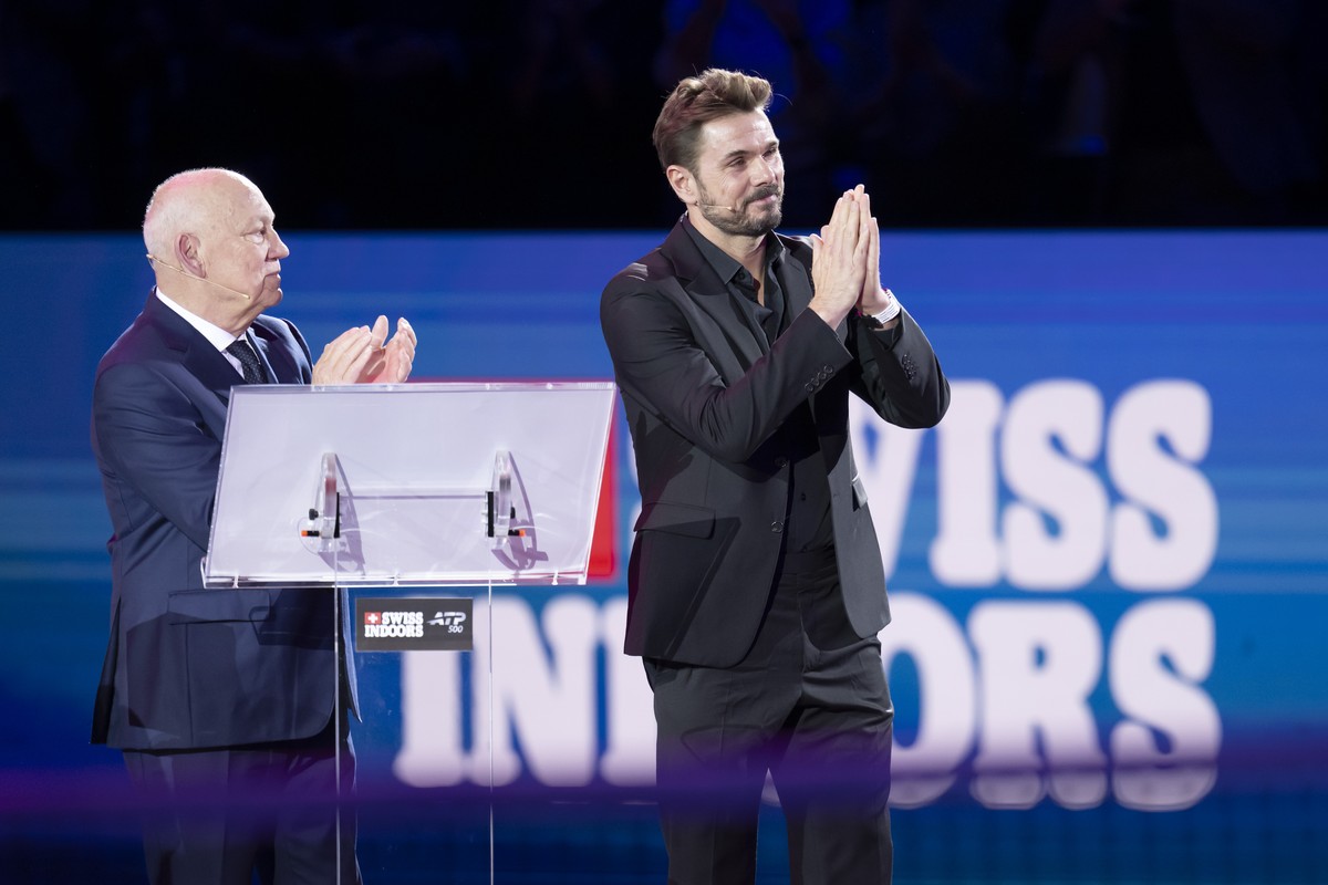 Tournament director Roger Brernnwald, left, and Stan Wawrinka, right, during his farewell ceremony at the Swiss Indoors tennis tournament at the St. Jakobshalle in Basel, Switzerland, on Monday, Octob ...