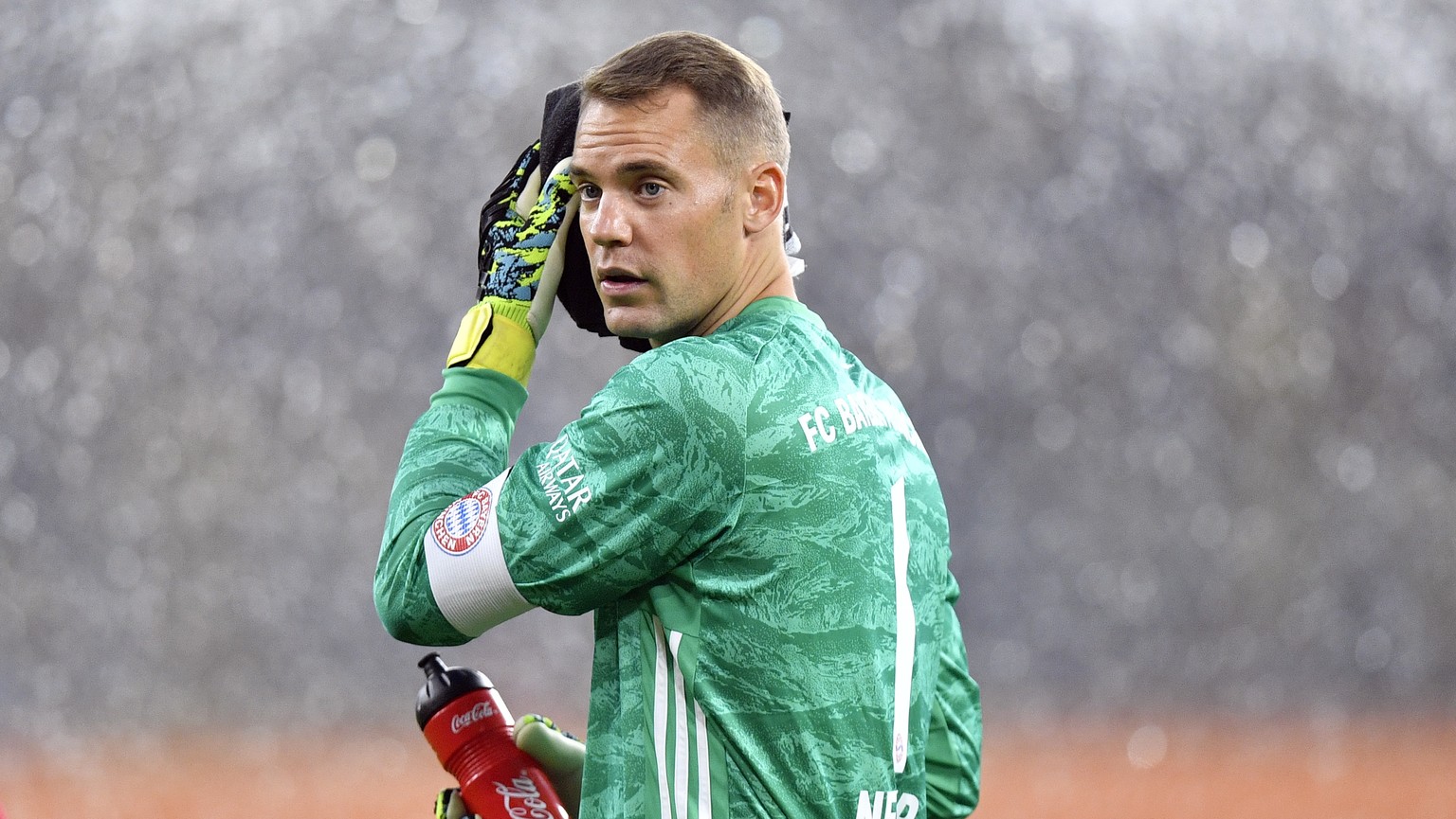 Bayern goalkeeper Manuel Neuer leaves the field after the first half of the German Supercup final soccer match between Borussia Dortmund and Bayern Munich in Dortmund, Germany, Saturday, Aug. 3, 2019. ...