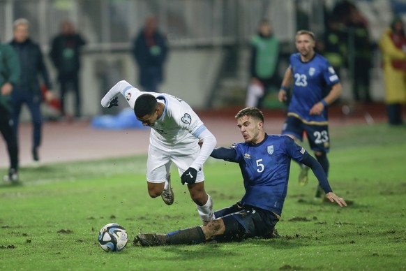 Kosovo&#039;s Ilir Krasniqi, right, vies for the ball with Israel&#039;s Idan Gorno during the Euro 2024 group I qualifying soccer match between Kosovo and Israel at the Fadil Vokrri stadium in Pristi ...