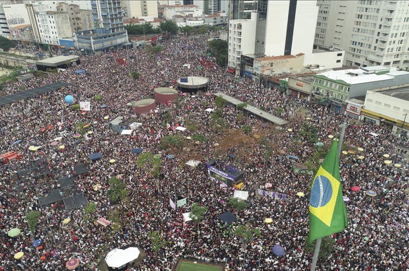 People protest against Jair Bolsonaro, the presidential front-runner, and far-right congressman, in Sao Paulo, Brazil, Saturday, Sept. 29, 2018. Bolsonaro has long been known for offensive comments ab ...
