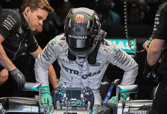 epa05448611 German Formula 1 racer Nico Rosberg from Mercedes AMG Petronas climbs out of his racecar in the box during the 3rd open training on the Hockenheimring in Hockenheim, Germany, 30 July 2016. ...