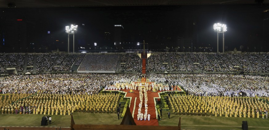 Pope Francis leaves after an open-air Mass at national sports stadium in Bangkok, Thailand, Thursday, Nov. 21, 2019. Pope Francis urged more efforts to combat the &quot;humiliation&quot; of women and  ...