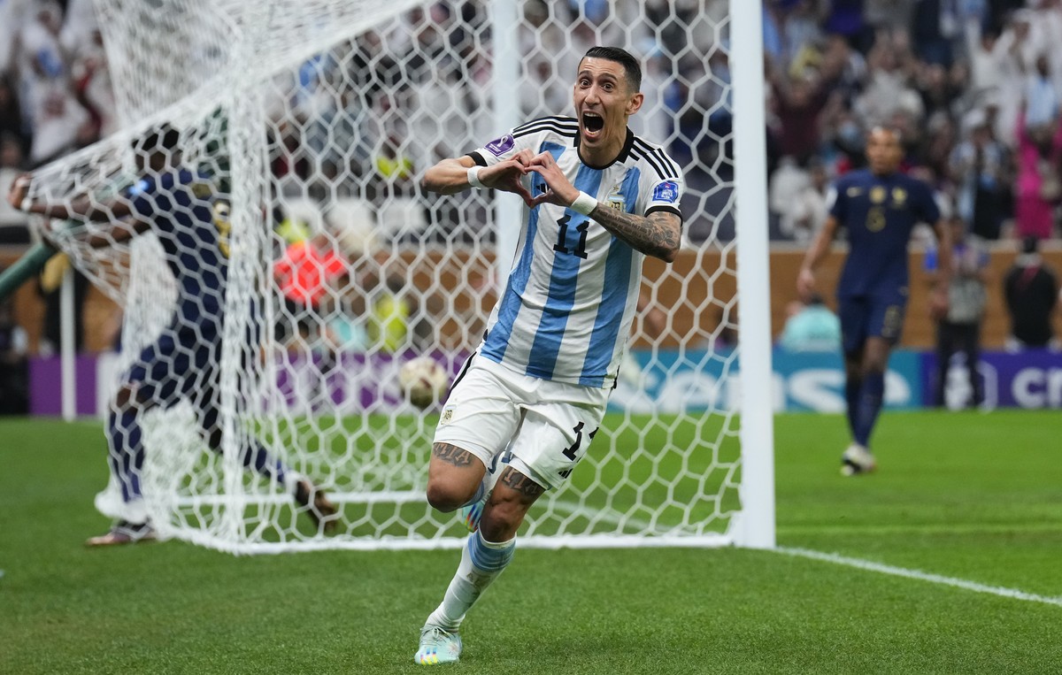 Argentina's Angel Di Maria celebrates scoring his side's second goal during the World Cup final soccer match between Argentina and France at the Lusail Stadium in Lusail, Qatar, Sunday, Dec. ...