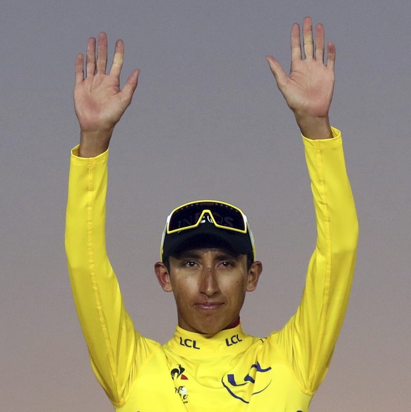 Colombia&#039;s Egan Bernal, the winner, center, Britain&#039;s Geraint Thomas, who placed second, left, and the Netherlands&#039; Steven Kruijswijk, third, stand on the podium of the Tour de France c ...