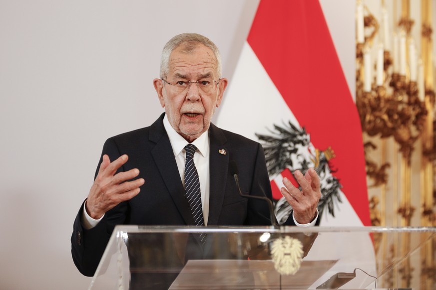 FILE - Austrian President Alexander Van der Bellen addresses the media during a joint press conference with the President of Ireland, Michael D. Higgins, in Vienna, Austria, April 6, 2022. (AP Photo/T ...