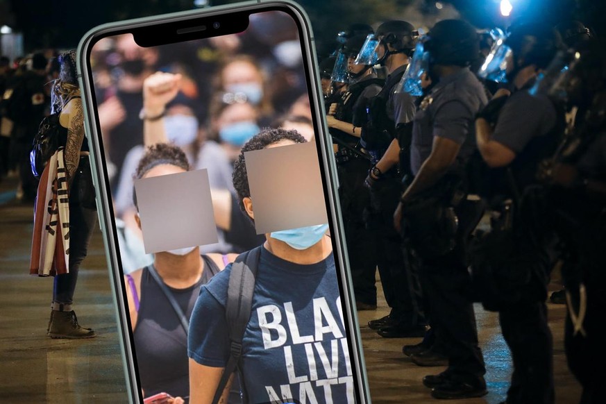 A protester confronts a line of police in riot gear near midnight Wednesday night, June 3, 2020, in Kansas City, Mo., after a unity march to protest against police brutality following the death of Geo ...