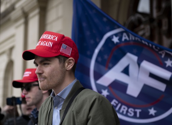 FILE - Nick Fuentes, far-right activist, holds a rally at the Lansing Capitol, in Lansing, Mich., Nov. 11, 2020. Former President Donald Trump had dinner Tuesday, Nov. 22, 2022, at his Mar-a-Lago club ...