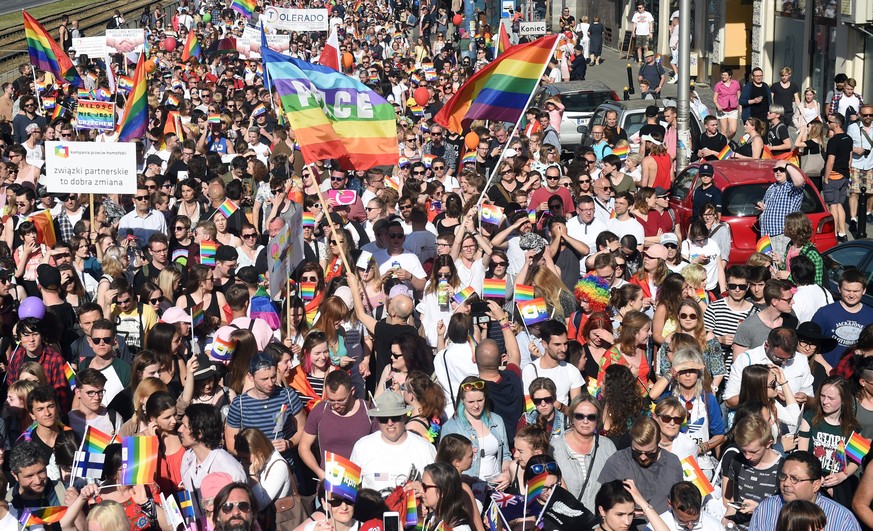 epa06008224 Representatives of Lesbian, Gay, Bisexual and Transgender (LGBT) organizations and their supporters take the street for a peaceful &#039;Equality Parade&#039; in downtown in Warsaw, Poland ...