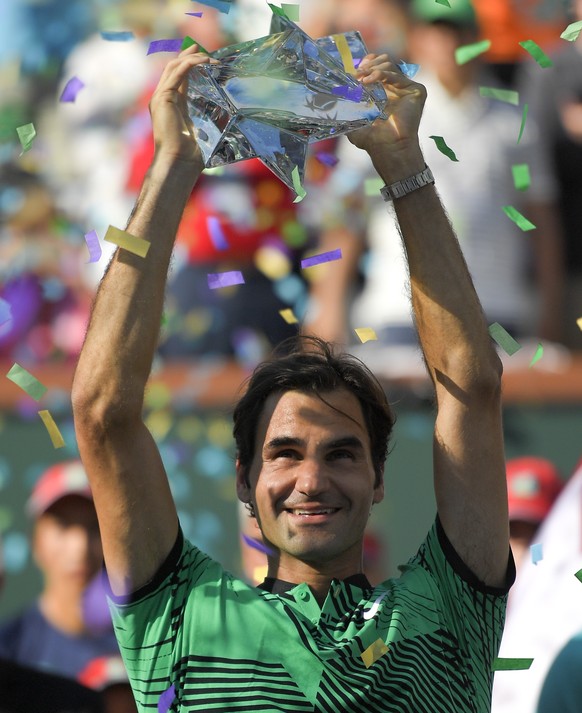 Roger Federer, of Switzerland, celebrates his 6-4, 7-5 win over Stan Wawrinka, of Switzerland, in the men&#039;s final of the BNP Paribas Open tennis tournament, Sunday, March 19, 2017, in Indian Well ...