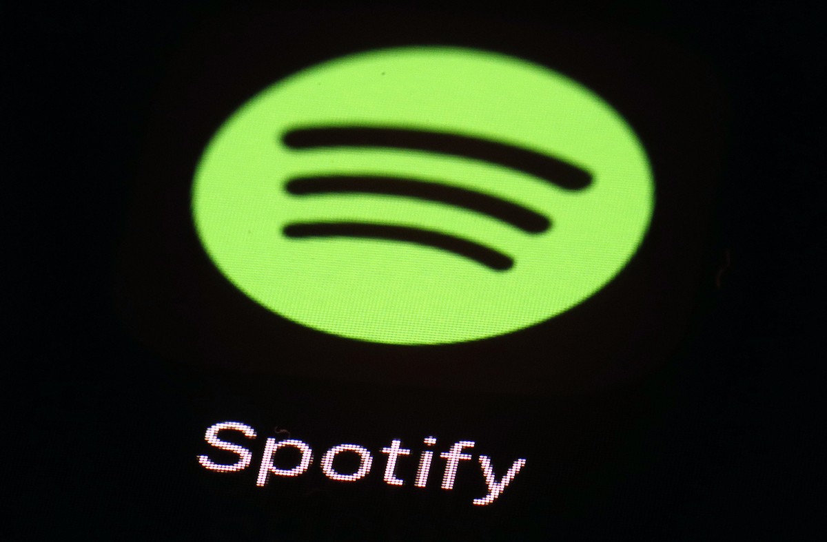 FILE- This March 20, 2018, file photo shows the Spotify app on an iPad in Baltimore. Spotify-owned Gimlet's popular