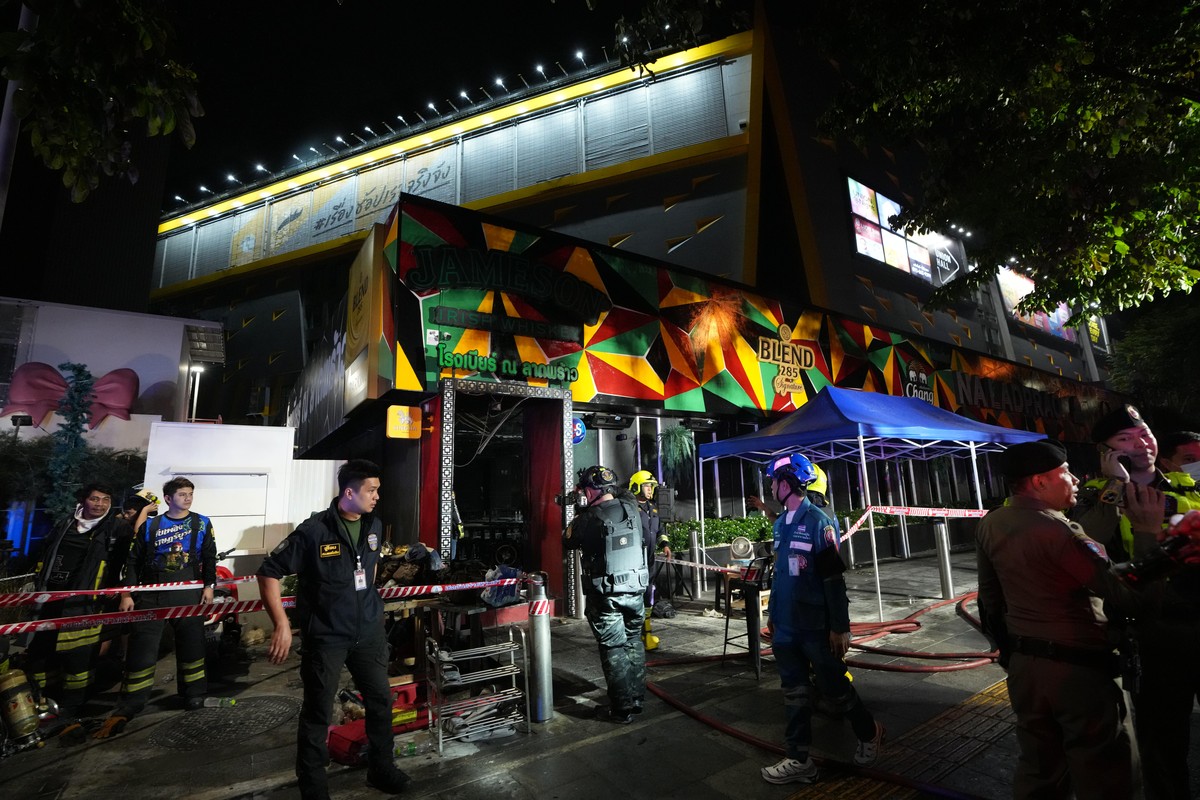 Rescuers stand near the site of a fire in Bangkok, Thailand, Monday, July 13, 2026. (AP Photo/Sakchai Lalit)
Thailand Fire