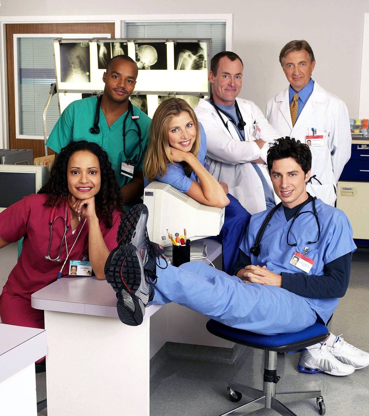 SCRUBS -- NBC Series -- Pictured: Judy Reyes as Nurse Carla Espinosa, Donald Faison as Chris Turk, Sarah Chalke as Elliott Reid, John C. McGinley as Dr. Phil Cox, Ken Jenkins as Dr. Bob Kelso, Zach Br ...