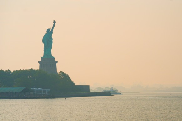 The Statue of Liberty is seen through a cover of wildfire smoke, in Jersey City, N.J., Friday, July 17, 2026. (AP Photo/Ryan Murphy)
Climate Wildfires Smoke New York