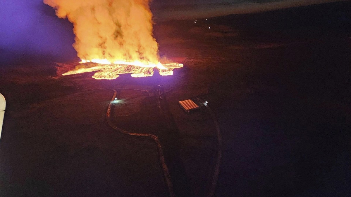 In this photo provided by Civil Protection taken from the Coast Guard's helicopter, a view of lava as the volcano erupts near Grindav�k, Iceland, Sunday, Jan. 14. 2024. A volcano has erupted in s ...