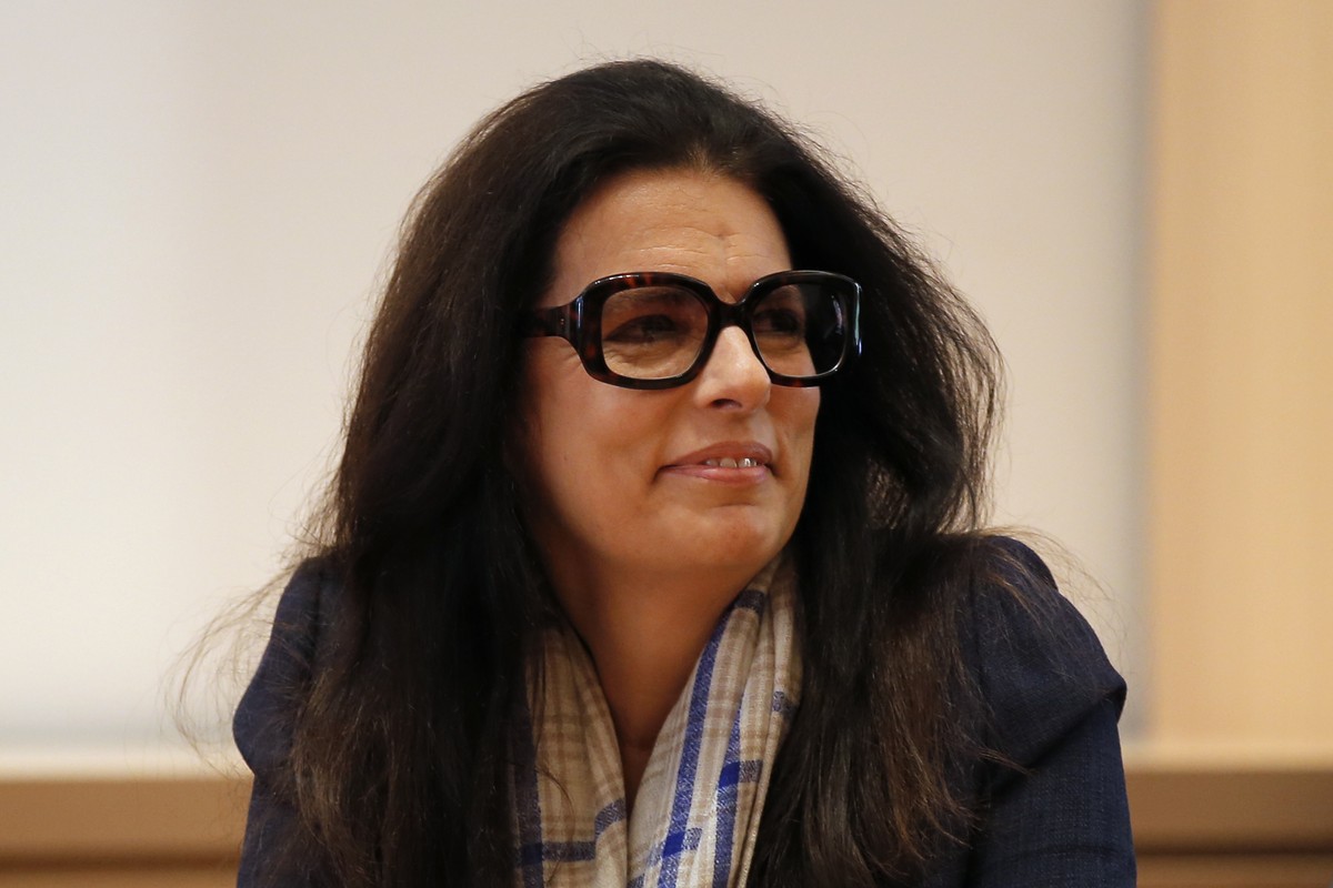 Francoise Bettencourt Meyers, daughter of L'Oreal cosmetics fortune heiress Liliane Bettencourt, and board member of the leading world cosmetics group, smiles during a visit with French prime Min ...