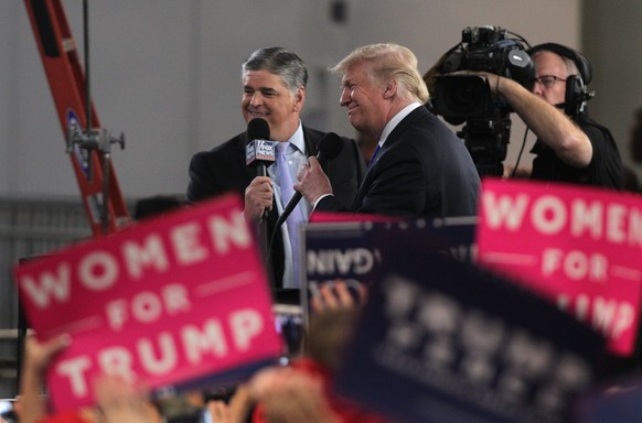 epa07036433 US President Donald J. Trump (R) participates in an interview with Sean Hannity (L) before addressing attendees during the Make America Great Again Rally at the Las Vegas Convention Center ...