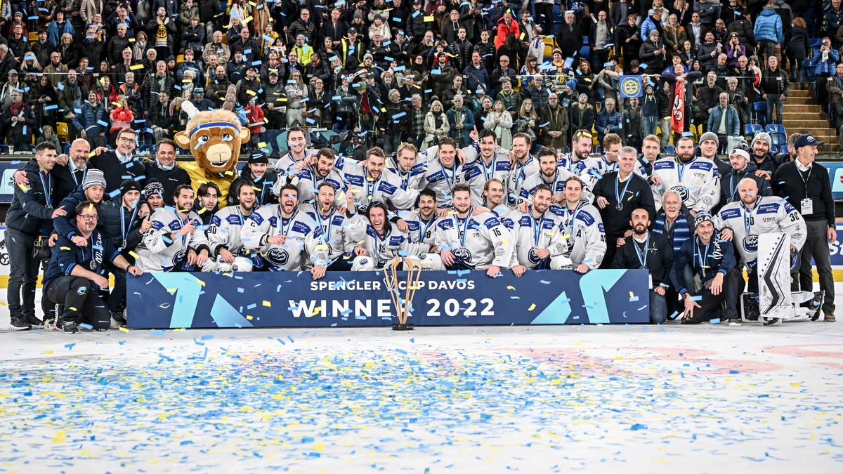 Team HC Ambri Piotta celebrate with the trophy after winning the final game between Czech Republic's Sparta Praha and Switzerland's HC Ambri-Piotta, at the 94th Spengler Cup ice hockey tourn ...