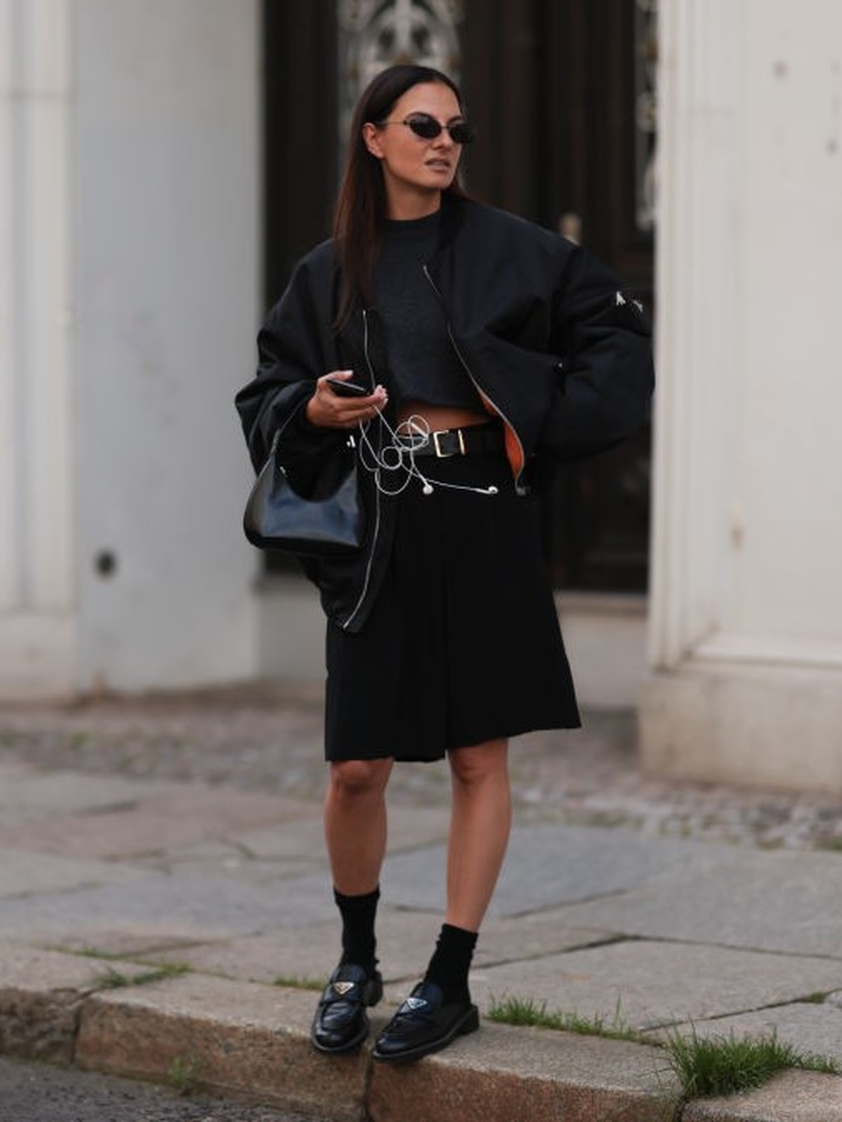 BERLIN, GERMANY - AUGUST 04: Anna Winter is seen wearing black round Balenciaga sunnies, grey cropped by Aylin Koenig shirt, oversized black Prada bomber jacket, black distressed vintage boyfriend sho ...